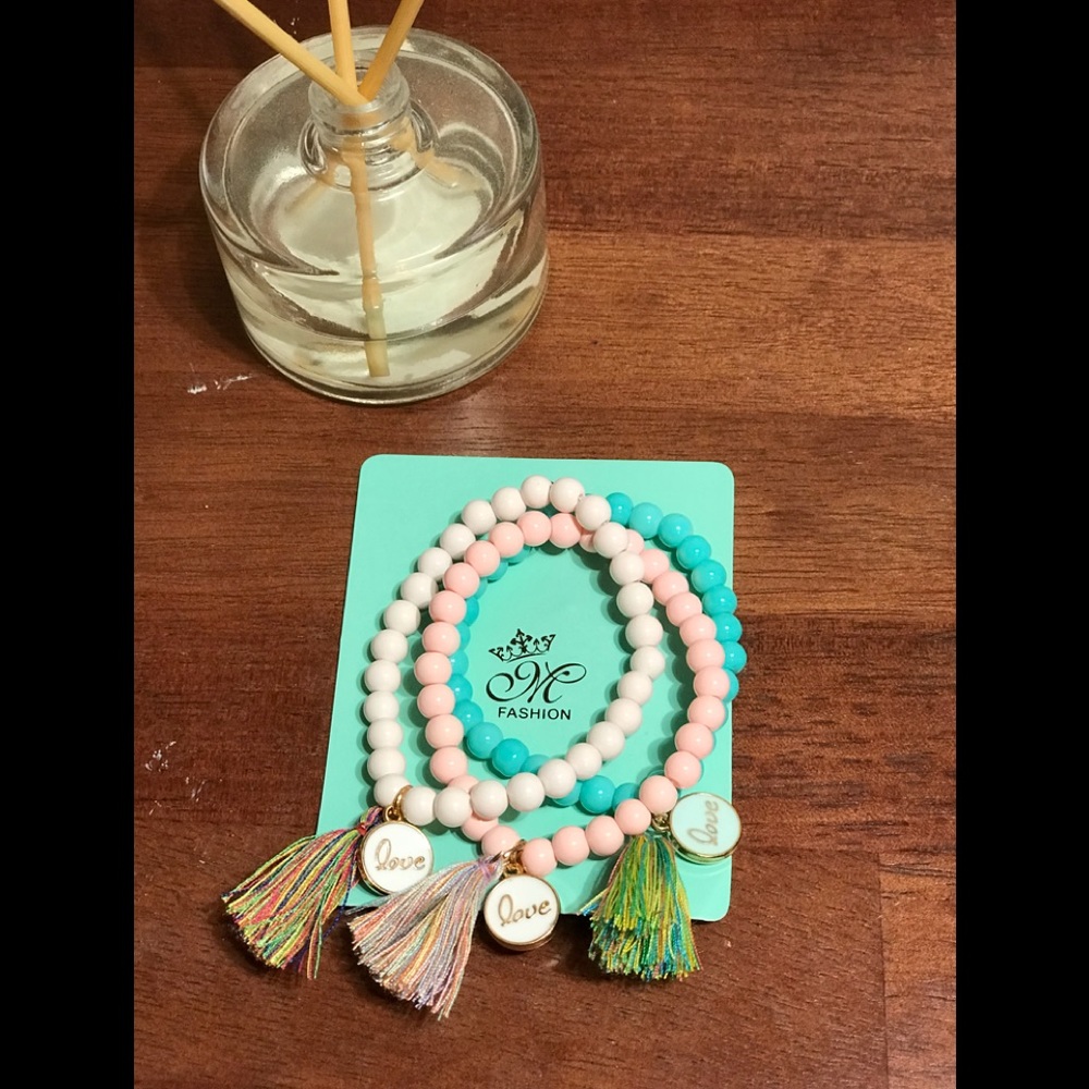 Three ceramic LOVE tassel bracelets